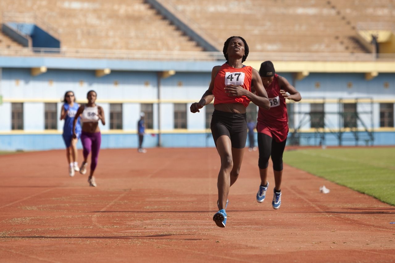 A sprinter racing on a running track